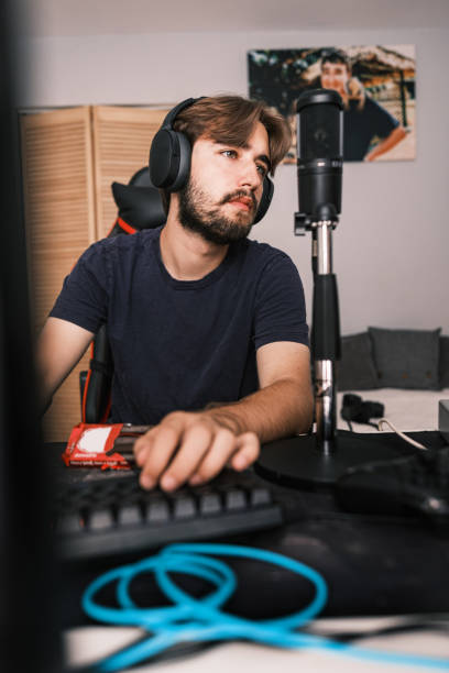 istock Young Caucasian man streaming with friends online 1691217849