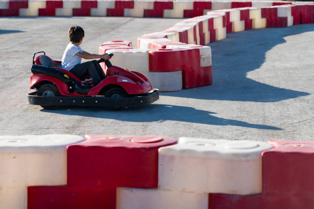 istock boy driving a battery-powered vehicle in a gokart 1691217854
