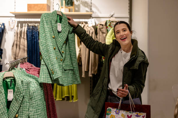 istock Young Woman Looking for Designer Clothing 1691218954