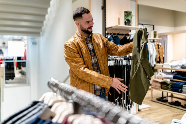 istock Young Man Shops for Everyday T-Shirts and Jeans 1691226193