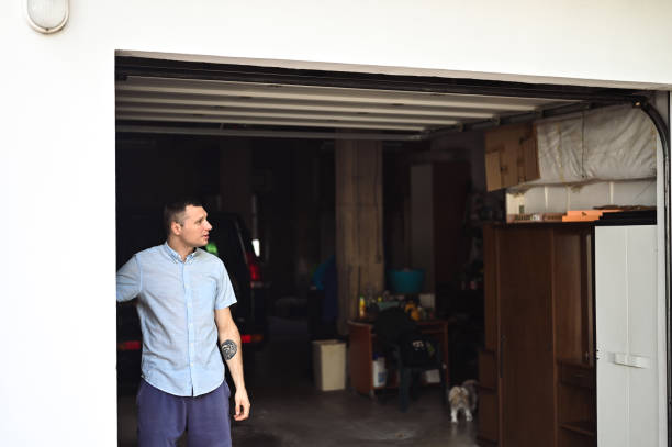 istock man controlling lifting gates of the garage. 1691233075