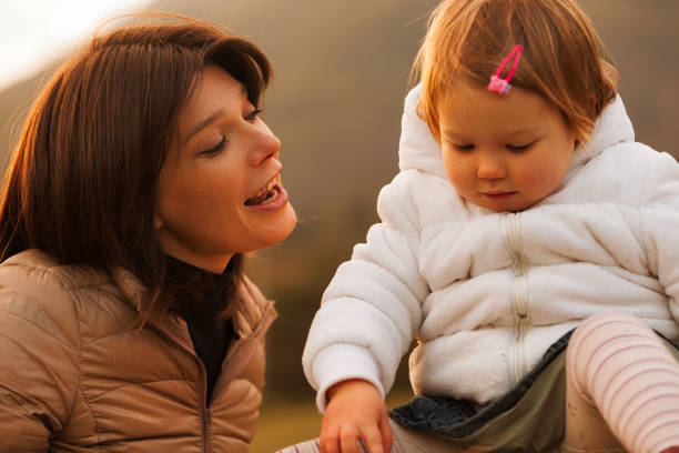 istock Mother sings, daughter listens, Holy Trinity blesses 1691234336
