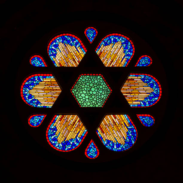 Stained glass windows inside of Church of St. Anthony of Padua. Interior of Sent Antuan Kilisesi catholic church in Istanbul, Turley. Sun shining through colorful glass windows.