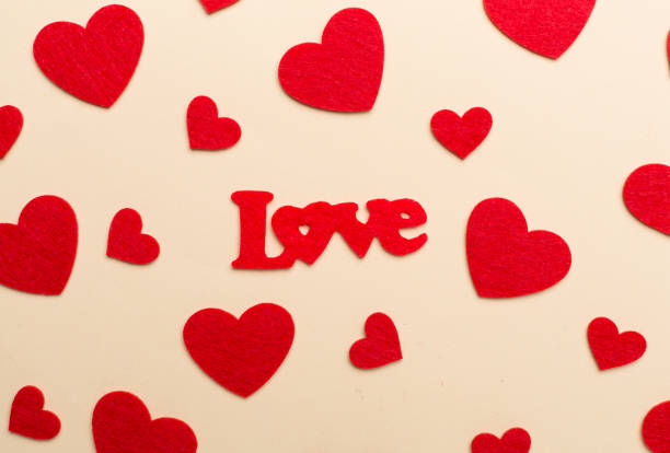 istock Felt word love with hearts on color background, top view 1691277164