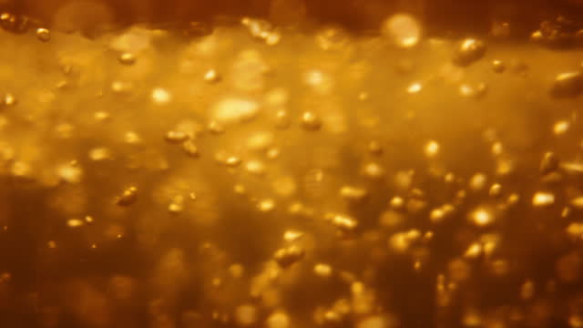 SLO MO Gold Colored Air Bubbles Ascending from River Bottom to Water Surface