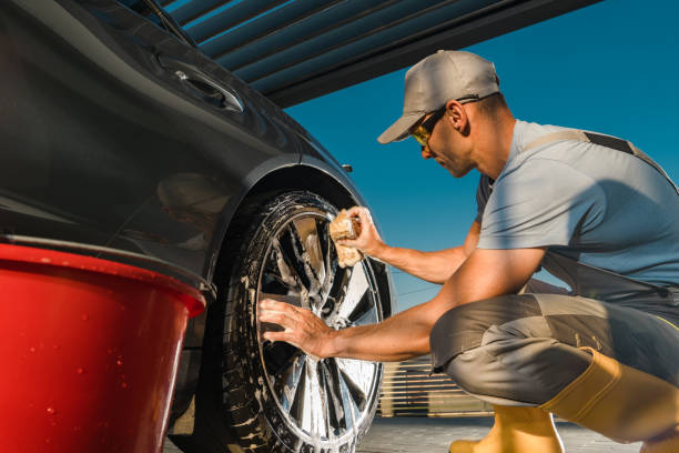 istock Worker Cleaning Modern Vehicle Alloy Wheels Using Professional Detergent 1691338251