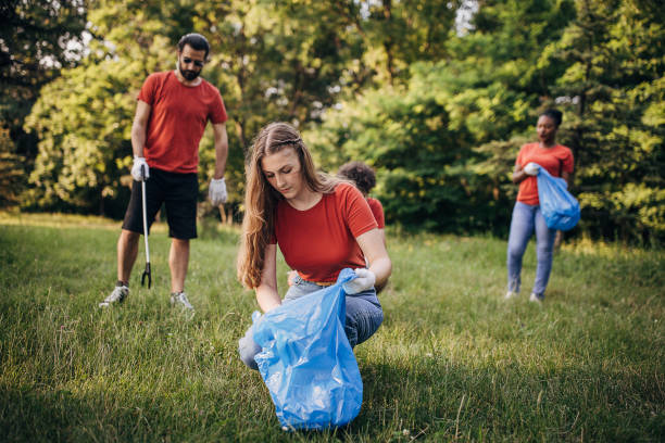 istock People cleaning nature together 1691343959