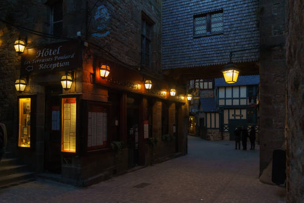 Gerona night medieval streets. Autumn night- long exposures with blurried people.