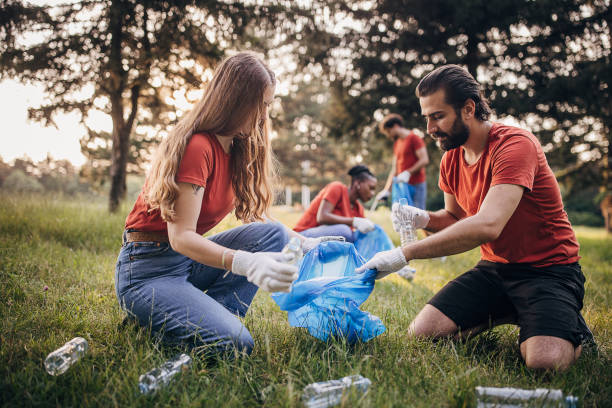 istock People cleaning nature together 1691353978