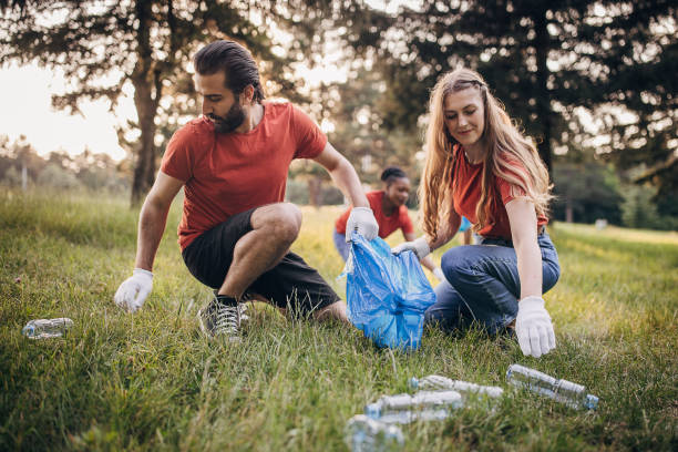 istock Couple cleaning nature 1691357543