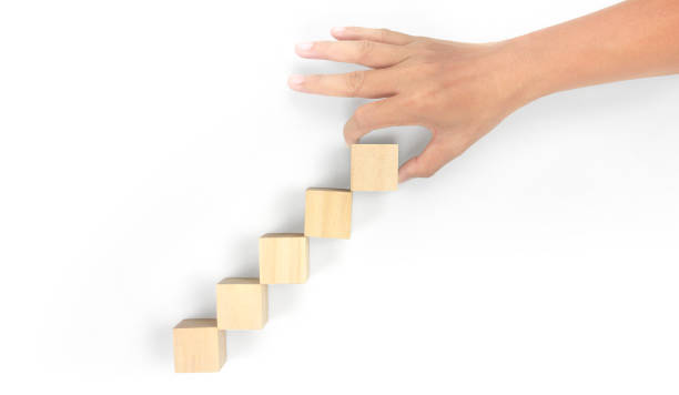 istock Business connecting piece of multi wood chart blocks steps in hand 1691366814