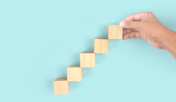 istock Business connecting piece of multi wood chart blocks steps in hand 1691366817