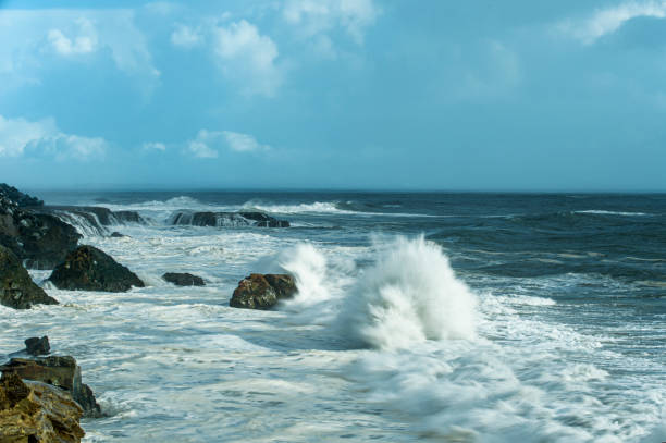 Large ocean waves crashing on rocky pacific shore.Taken in Santa Cruz, California, USA