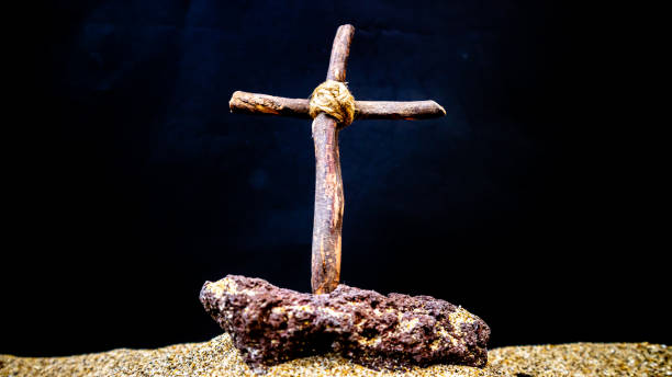istock wooden cross on black background 1691388656
