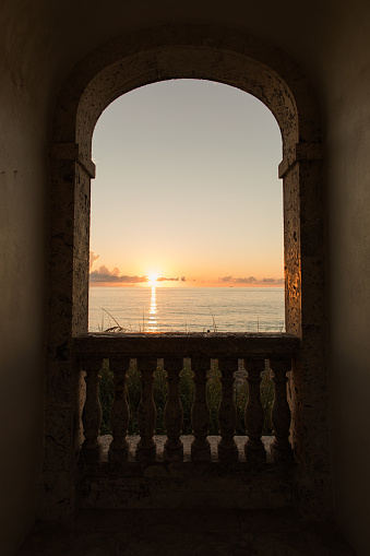 Golden Orange Sunrise Through a Window in the Worth Avenue Clock Tower in Palm Beach, Florida on September 15th, 2023