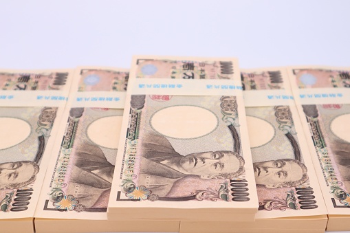 Close-up photo of a large number of Japanese 10,000 yen bills