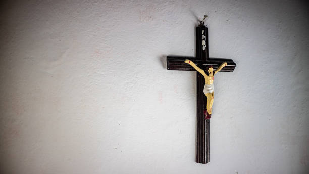 istock a cross hung on a white wall 1691399291