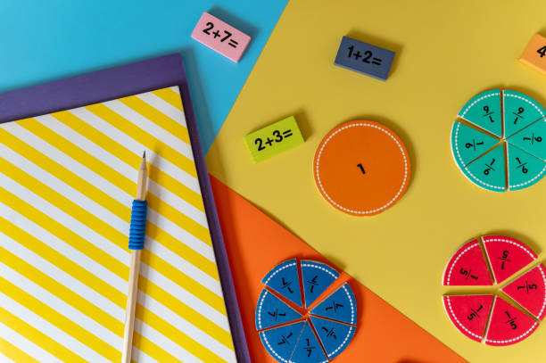 istock Colorful math fractions, numbers, letters on yellow background. Interesting, fun math for kids. Education, back to school concept 1691399818