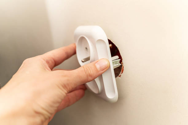 istock White broken electrical socket fell out of the wall. The socket is torn from the wall. A violation of electric safety, risk of electric shock 1691406999