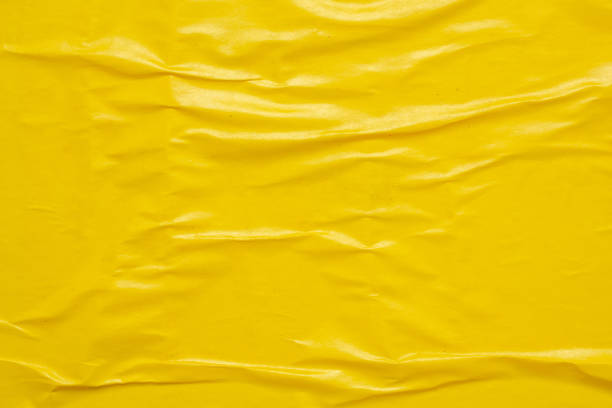 istock Blank yellow crumpled and creased paper poster texture background 1691408547