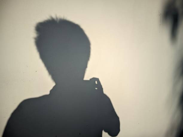istock the shadow of someone being narcissistic while taking photos on the wall 1691409023