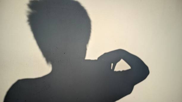 istock the shadow of someone being narcissistic while taking photos on the wall 1691409092
