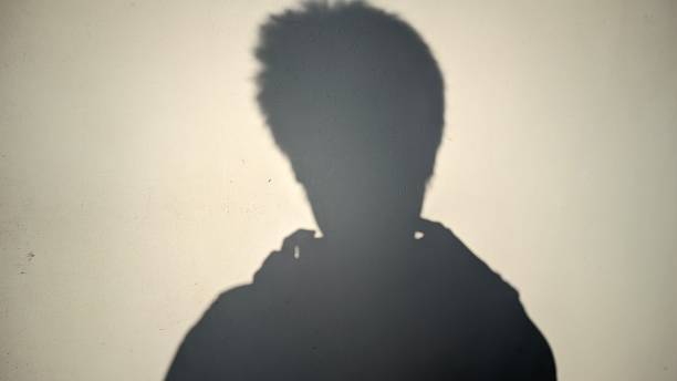 istock the shadow of someone being narcissistic while taking photos on the wall 1691409123