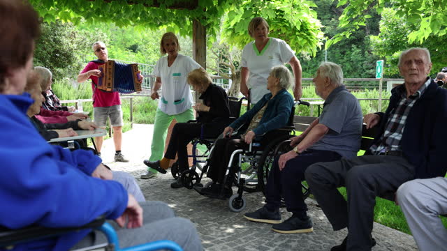 Nursing Home outdoor party with Harmonica musing and singing