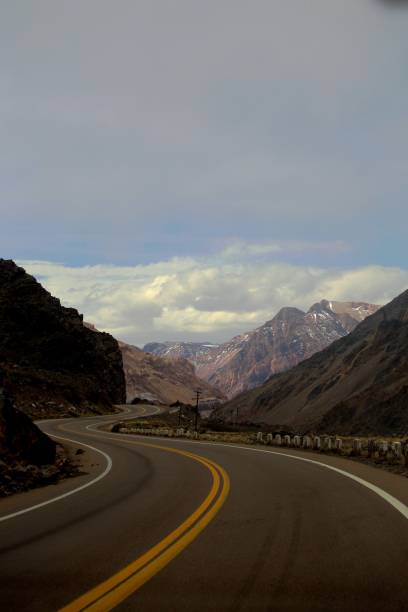 istock Road in middle mountains leading up to Andes peaks 1691416641