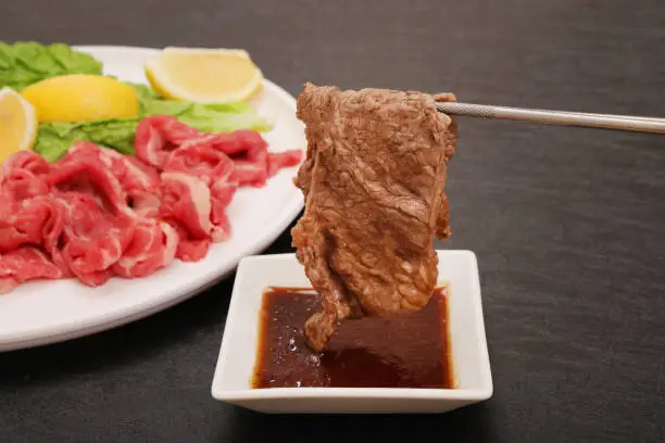 Japanese beef yakiniku served with soy sauce
Japanese oriental cuisine where the meat is dipped in sauce and grilled.
