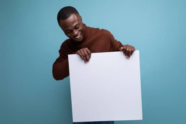 istock successful african businessman demonstrates his projects using a white sheet of screen 1691475696