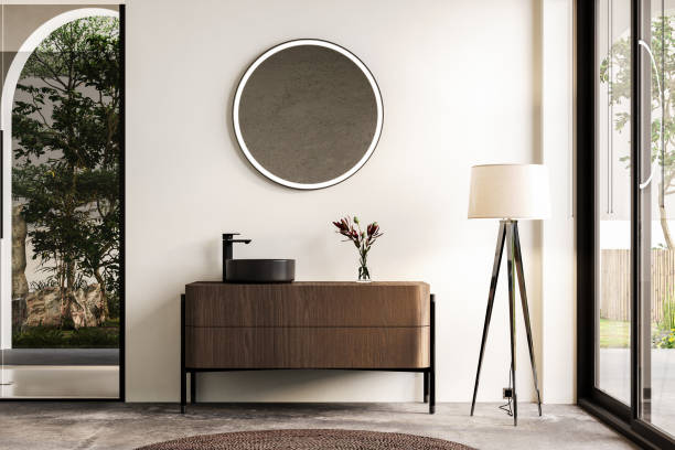 istock Modern bathroom interior with white walls, black sink with oval mirror, bathtub, grey concrete floor. Minimalist bright bathroom with modern furniture 1691476816