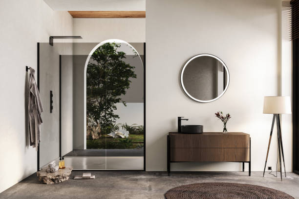 istock Modern bathroom interior with white walls, black sink with oval mirror, bathtub, grey concrete floor. Minimalist bright bathroom with modern furniture 1691477958