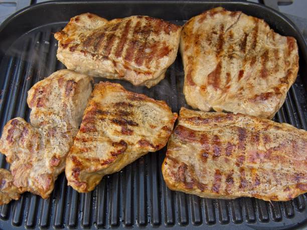 istock Pork chops are grilled on a griddle 1691480174
