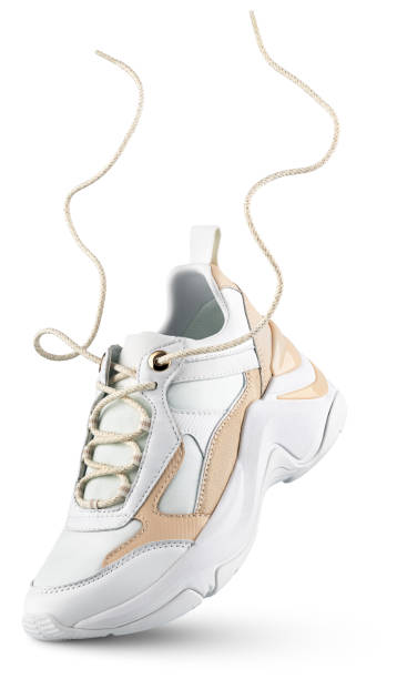 istock White sneaker with flying laces stands on the tip isolated on white 1691482423