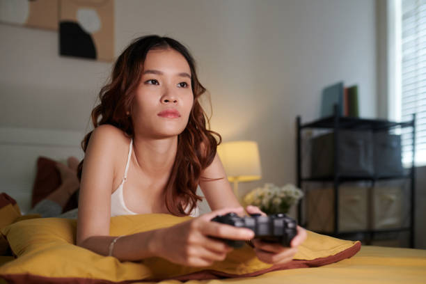 istock Woman Spending Time Playing Videgames 1691485405