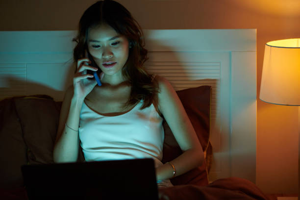 istock Woman Calling Coworker to Discuss Release 1691485423