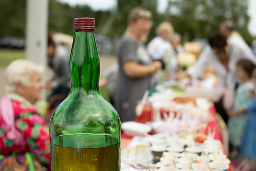 Large bottle of alcohol. Strong drink in green bottle. in Moscow, Moscow, Russia