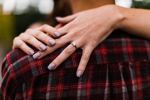 Woman's hand showcasing her diamond engagement ring in Edgewood, Washington, United States