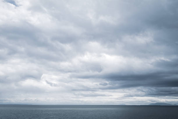 Moody Cloudscape Over The Ocean stock photo
