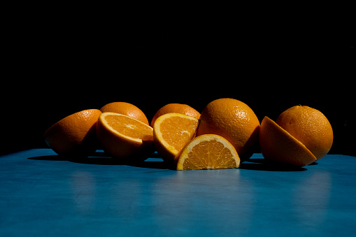 Still life with oranges on blue table. in United States, District of Columbia, Washington