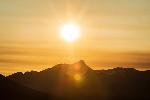 istock Mountain Silhouette in golden sun 1691558089