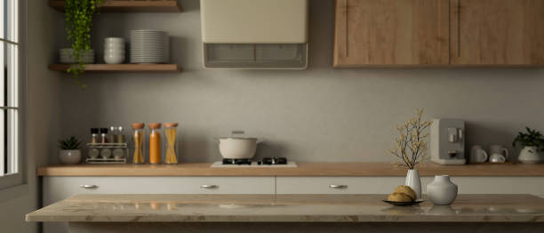 istock Copy space on a kitchen island or kitchen countertop in a minimalist Scandinavia kitchen interior. 1691559284