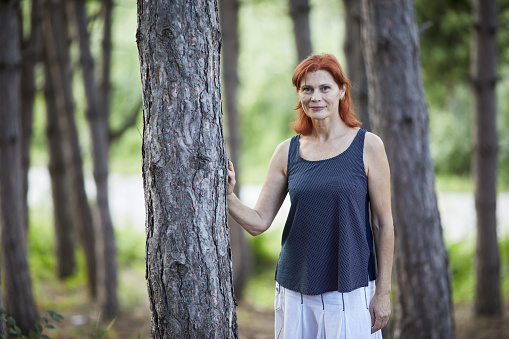 portrait of smiling senior woman in the forest in Chişinău, Chisinau, Moldova