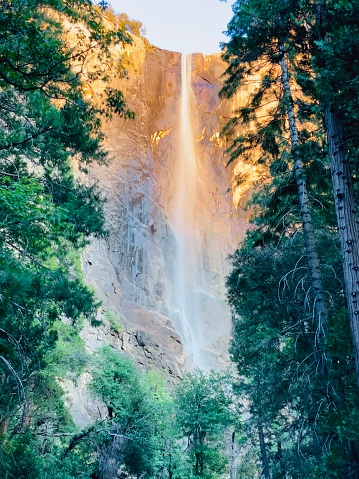A sunset image of Bridal-veil Fall in Yosemite National Park with the falls glowing from the setting sun