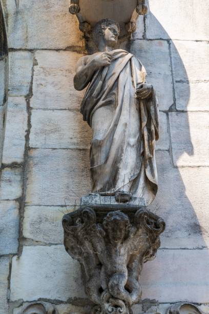 istock Vertical of Milan Cathedral statue on the outside wall. 1691610548