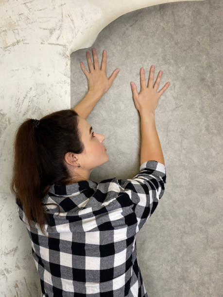 TEacher writing on the chalkboard