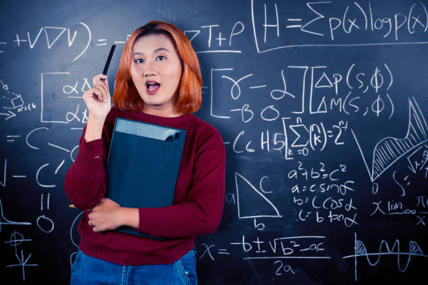 istock Young stylish woman holds on digital tablet while pointing with the stylus 1691678390