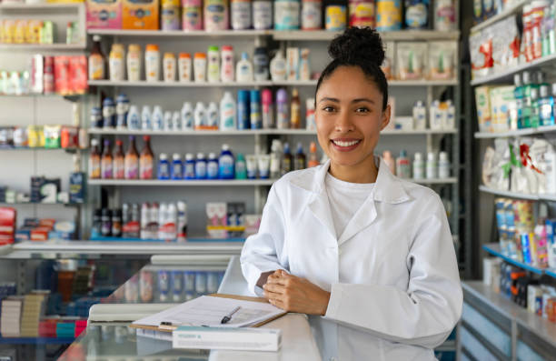 istock Happy pharmacist working at the drugstore 1691694913