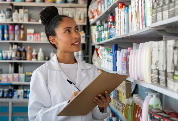 istock Happy pharmacist making an inventory at the drugstore 1691694914